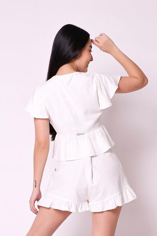 BLUSA CROPPED CON VOLADO Y ABERTURA