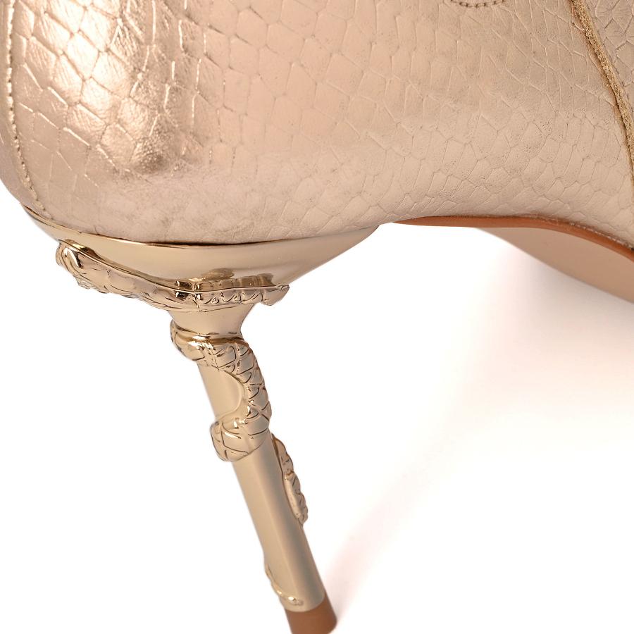 BOTA DORADA CON TEXTURA Y ACCESORIO