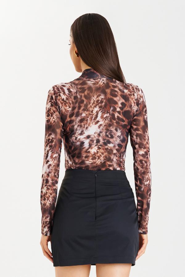 BLUSA CON TRANSPARENCIA ANIMAL PRINT